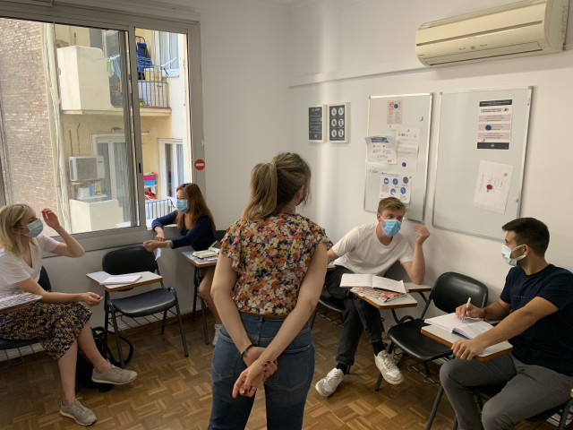 students wearing masks, studying Spanish