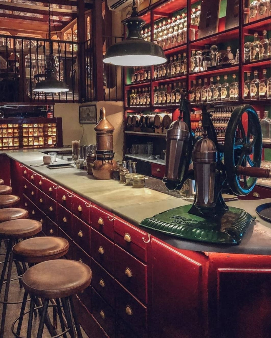Image of cool bar with mysterious bottles.