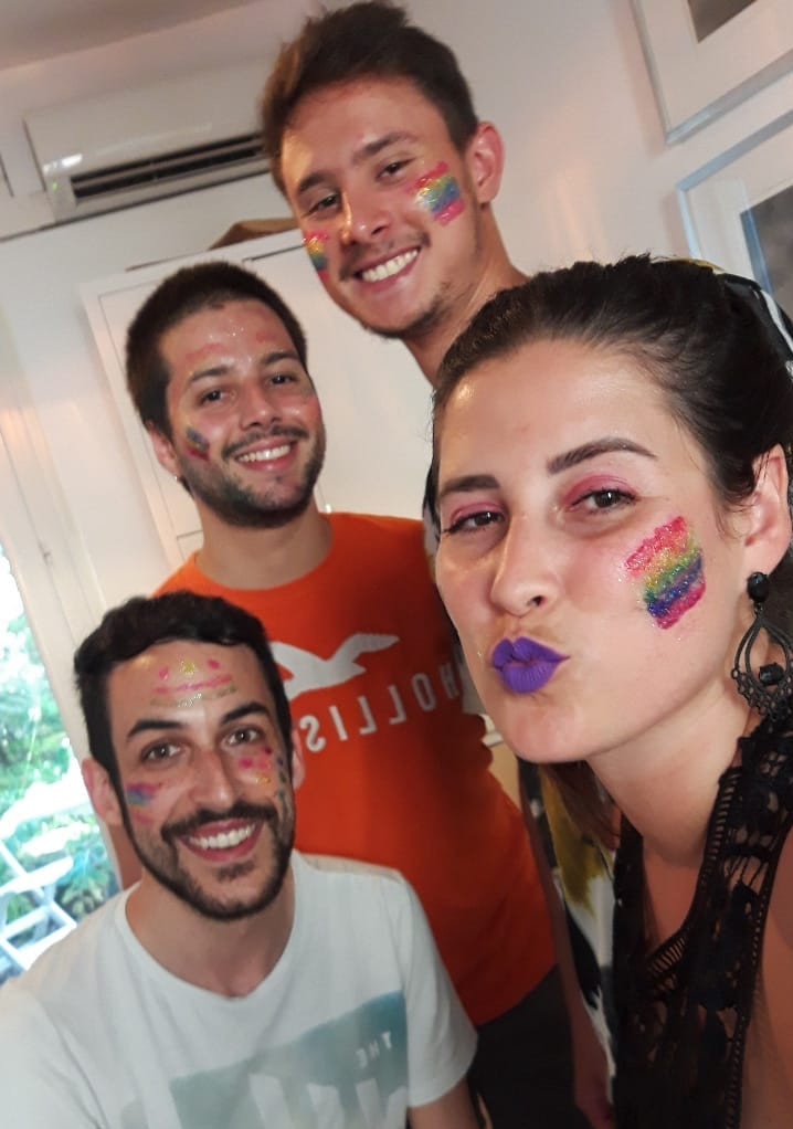 Smiling people with face paint.