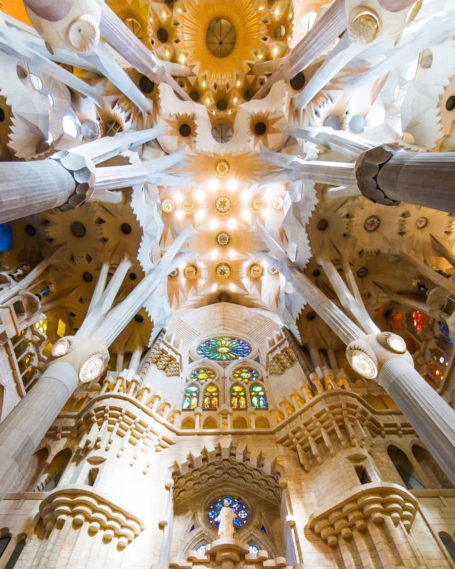 Interior of Sagrada Familia looking towards the ceiling.