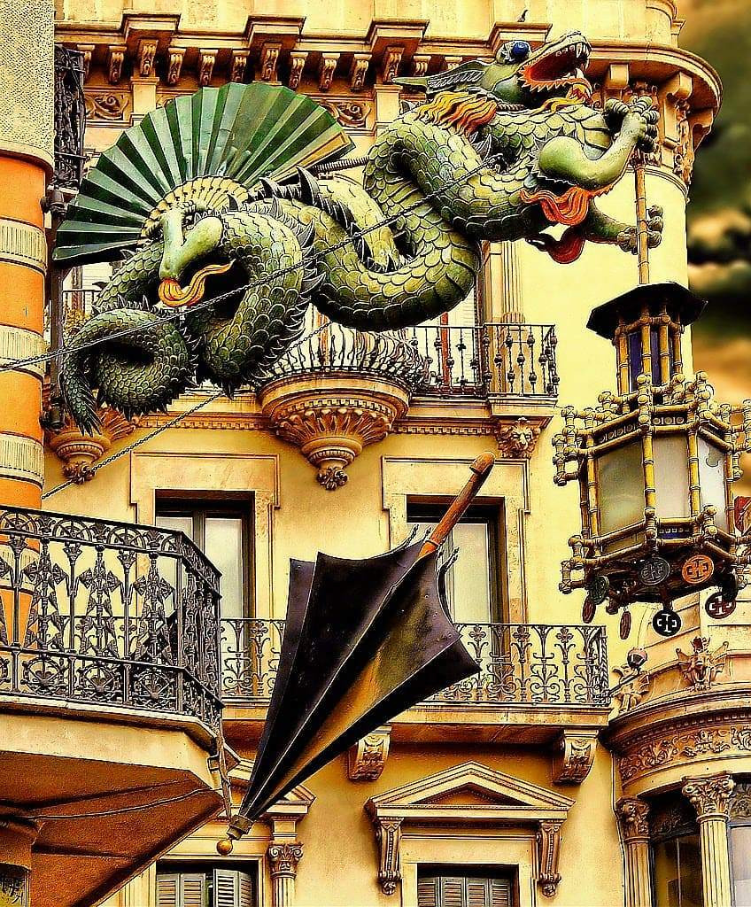 Dragon sculpture in front of a building in Barcelona.