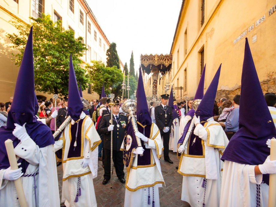 Traditional brotherhood with capirotes in Spanish Easter procession.
